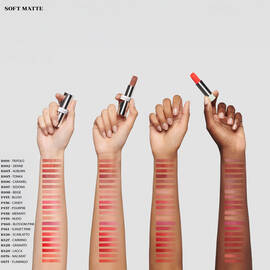Arm swatches of 18 shades of Prada Monochrome Soft Matte Lipstick on four different skin tones.