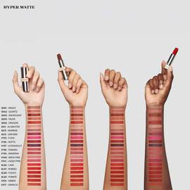 Arm swatches of 21 shades of Prada Monochrome Hyper Matte Lipstick on four different skin tones.