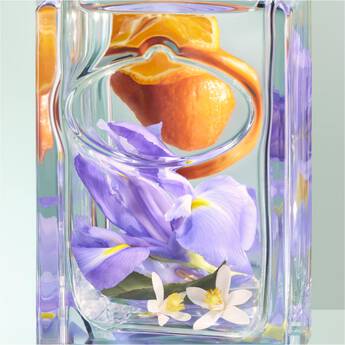 Perfume bottle with flowers and orange inside