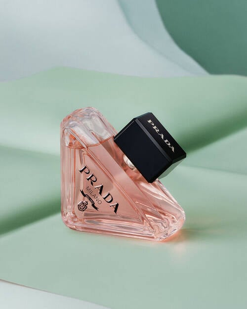 Prada Paradoxe Eau de Parfum on a textured green background