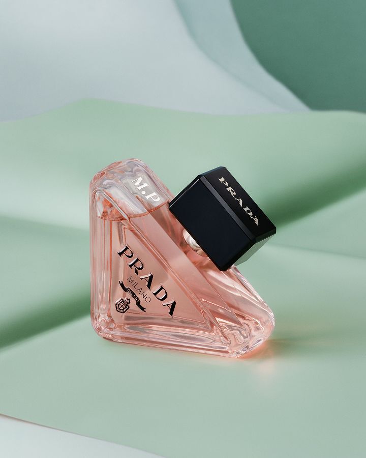 Prada Paradoxe Eau de Parfum on a textured green background
