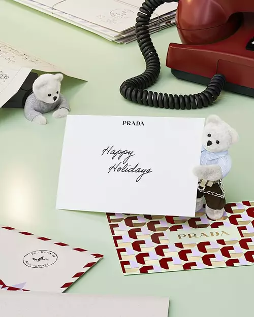 Prada Beauty Digital Services E-Gift Card - Holiday card with teddy bears, letters, and red phone on a light green background