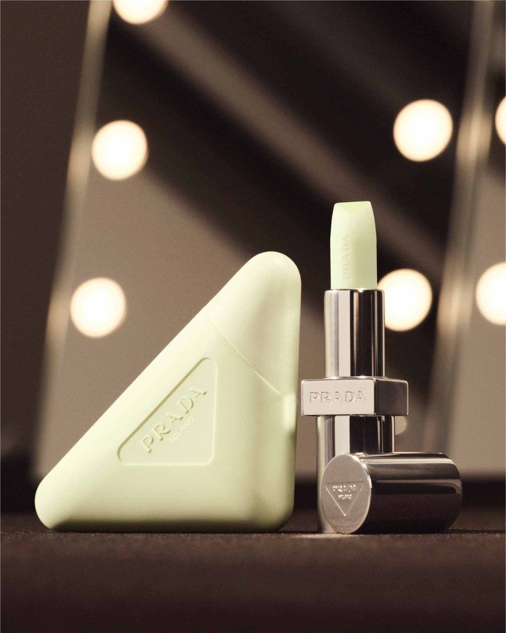 Prada Balm Universal next to Prada Hand Cream backstage from the runway.