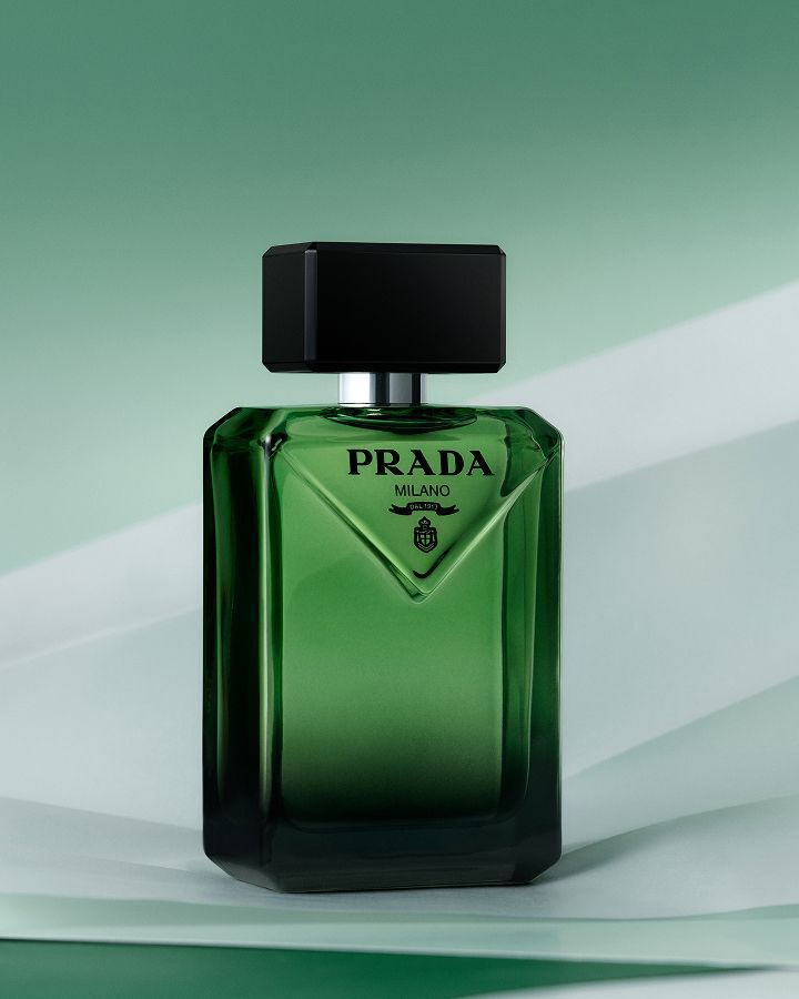 Prada Paradigme Eau de Parfum on a textured green background