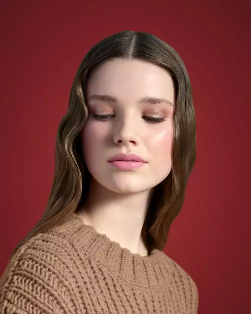 Prada Beauty Light Skin Visual on a light green background wearing Prada Touch Blush in shade Caffe, Dahlia + Monochrome Hyper Matte, Prada Lines Eye Pencil, Pradascope Mascara and Prada Dimensions Eye Shadow in shade Mahogany.