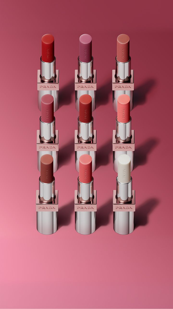 Prada Light Glowing Lipcolor range (nine shades) on a pink background 