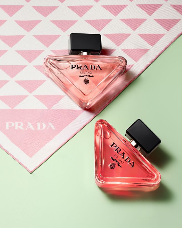 Prada Paradoxe Eau De Parfum and Eau De Parfum Intense Pradaness Lifestyle with pink Prada silk and light green background