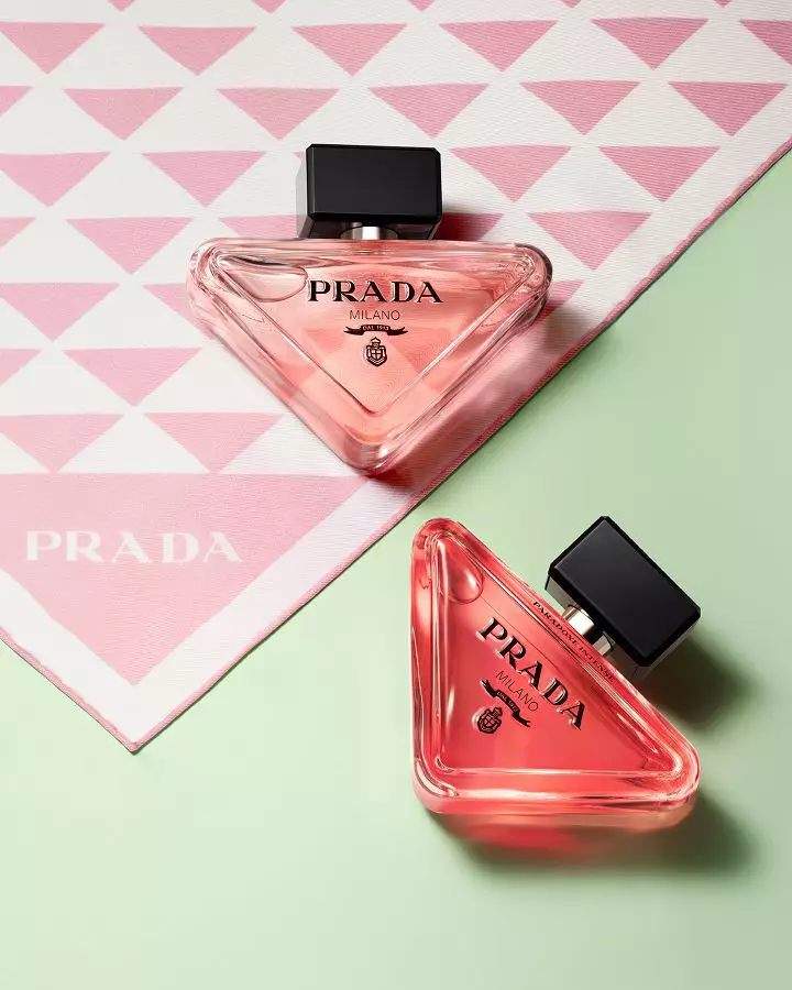 Prada Paradoxe Eau De Parfum and Eau De Parfum Intense Pradaness Lifestyle with pink Prada silk and light green background