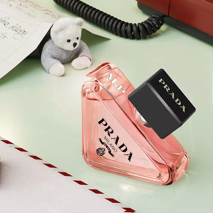Prada Beauty Holiday Engraving Paradoxe Eau de Parfum with teddy bear and letters on light green background