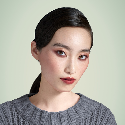 Eastern Model is wearing Prada Touch Blush, Monochrome Hyper Matte Lipstick, Lines Eye Pencil, Pradascope Mascara and Dimensions Eye Shadow.