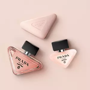 Prada Paradoxe collection with Eau de Parfum, Hair Mist and Hand Cream on a light pink background