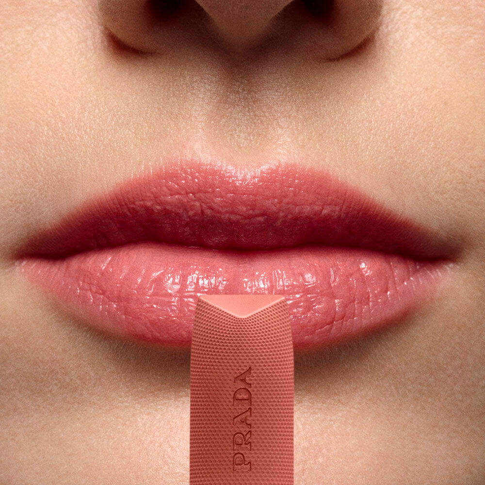 Close-up of lips wearing Prada Balm Lip Optimizing Care in shade U013.