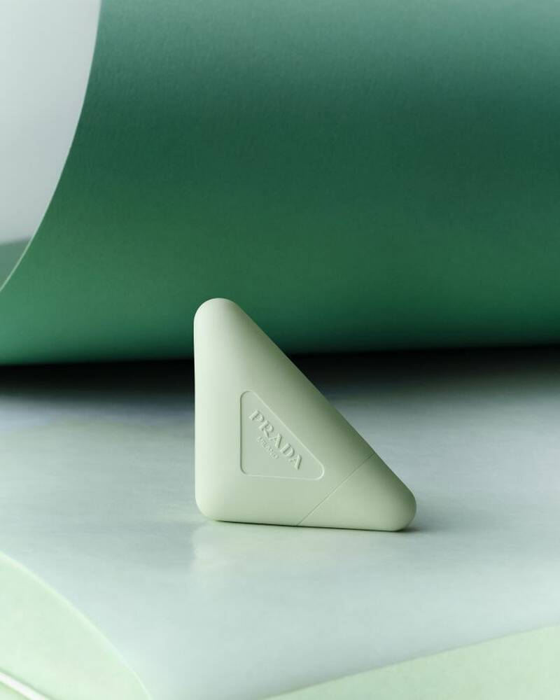 Prada Hand Cream on a textured green background