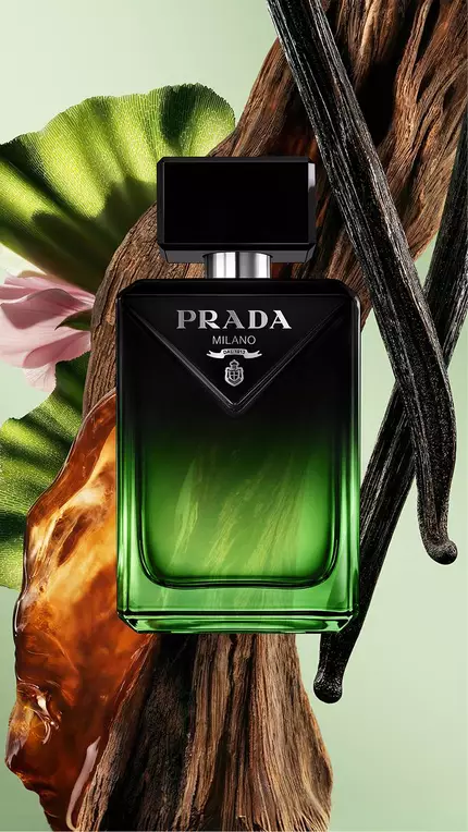 Prada Paradigme Le Parfum Pack with ingredients on a green background