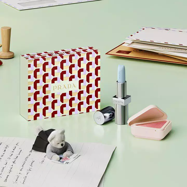 Prada Beauty Holiday Gift Set Prada Touch Blush P72 DAHLIA + Prada Balm U001 ASTRAL PINK with teddy bear and letters on light green background