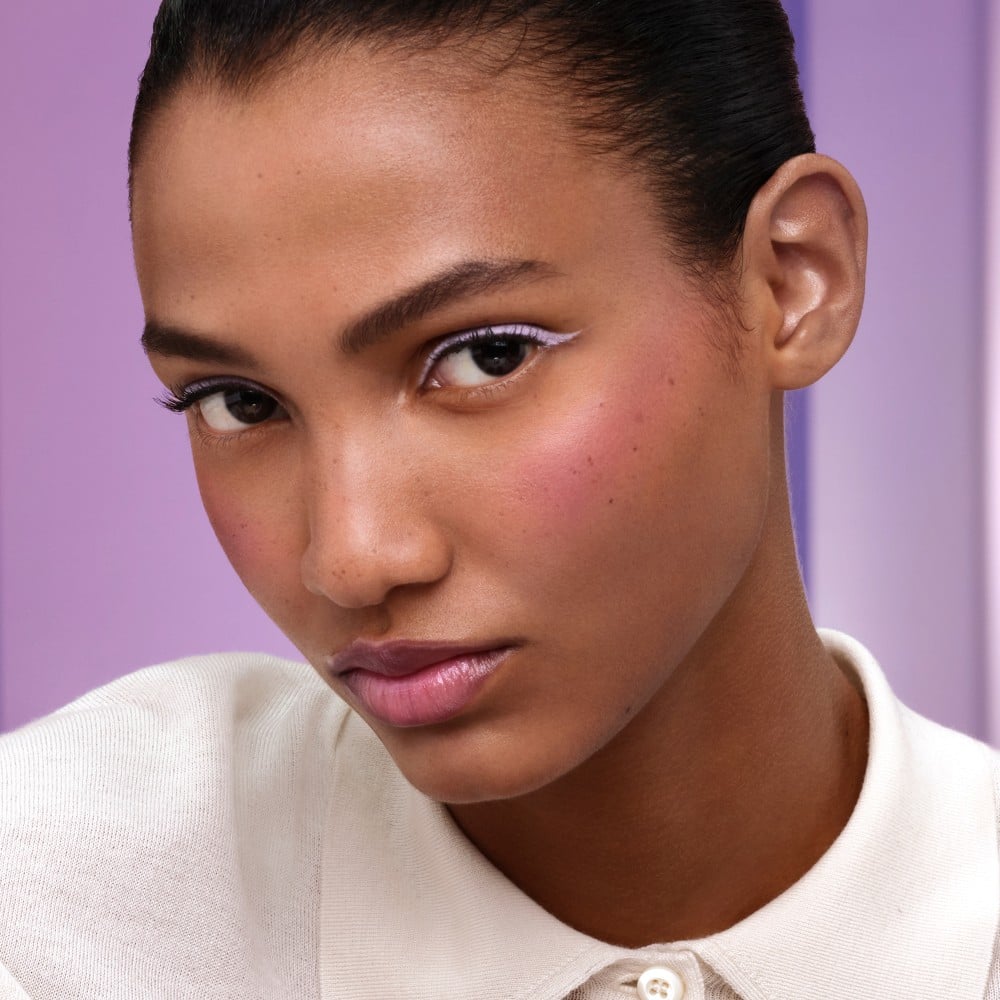 Prada Wisteria Collection Purple Balm, Violet Blush and Eyeliner on a medium skin model