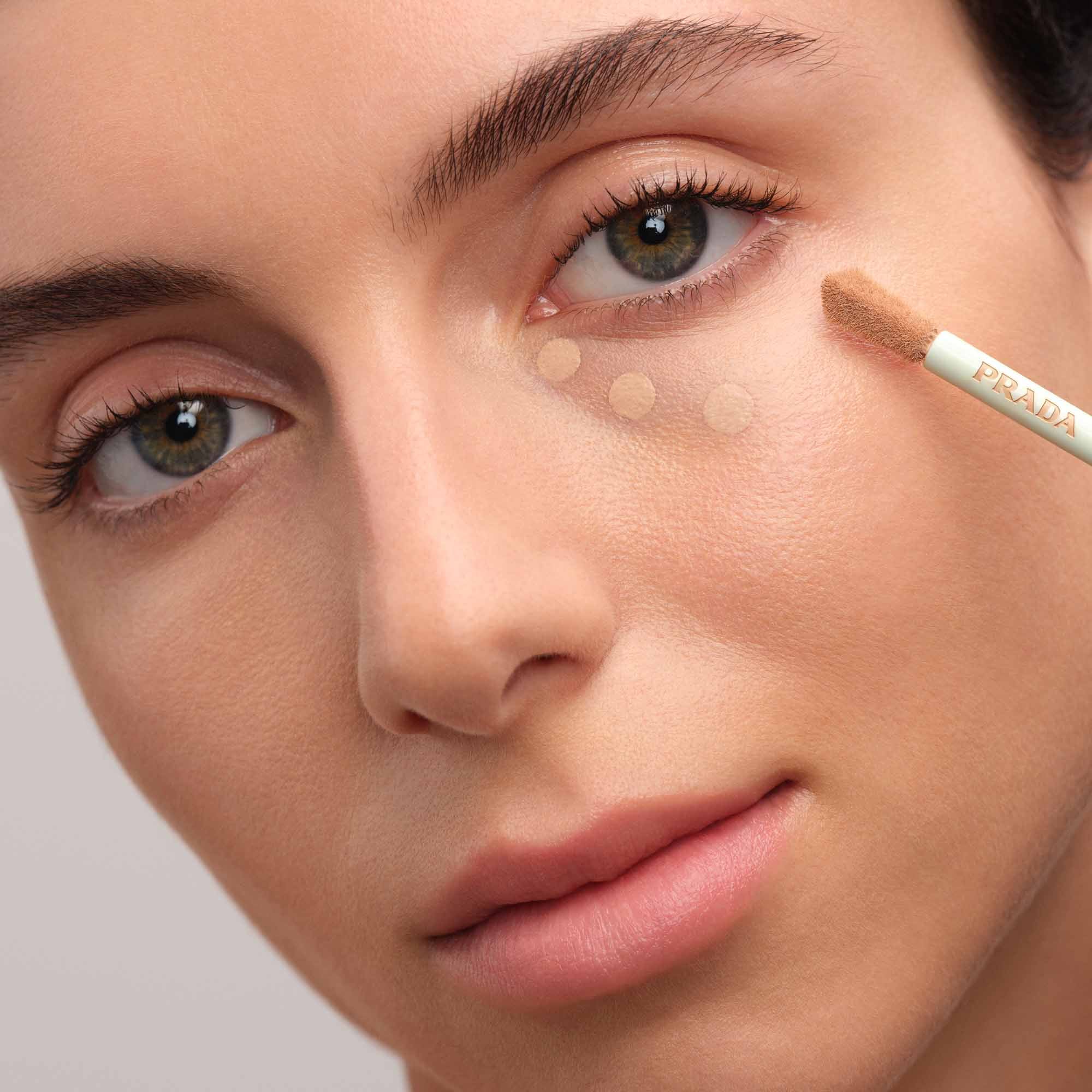 Model applying Prada Conceal.