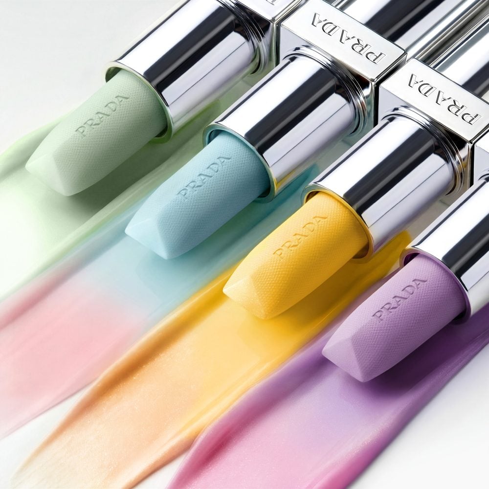Prada Balm Lip Hydrating Care Range Four shades with texture on a neutral background 