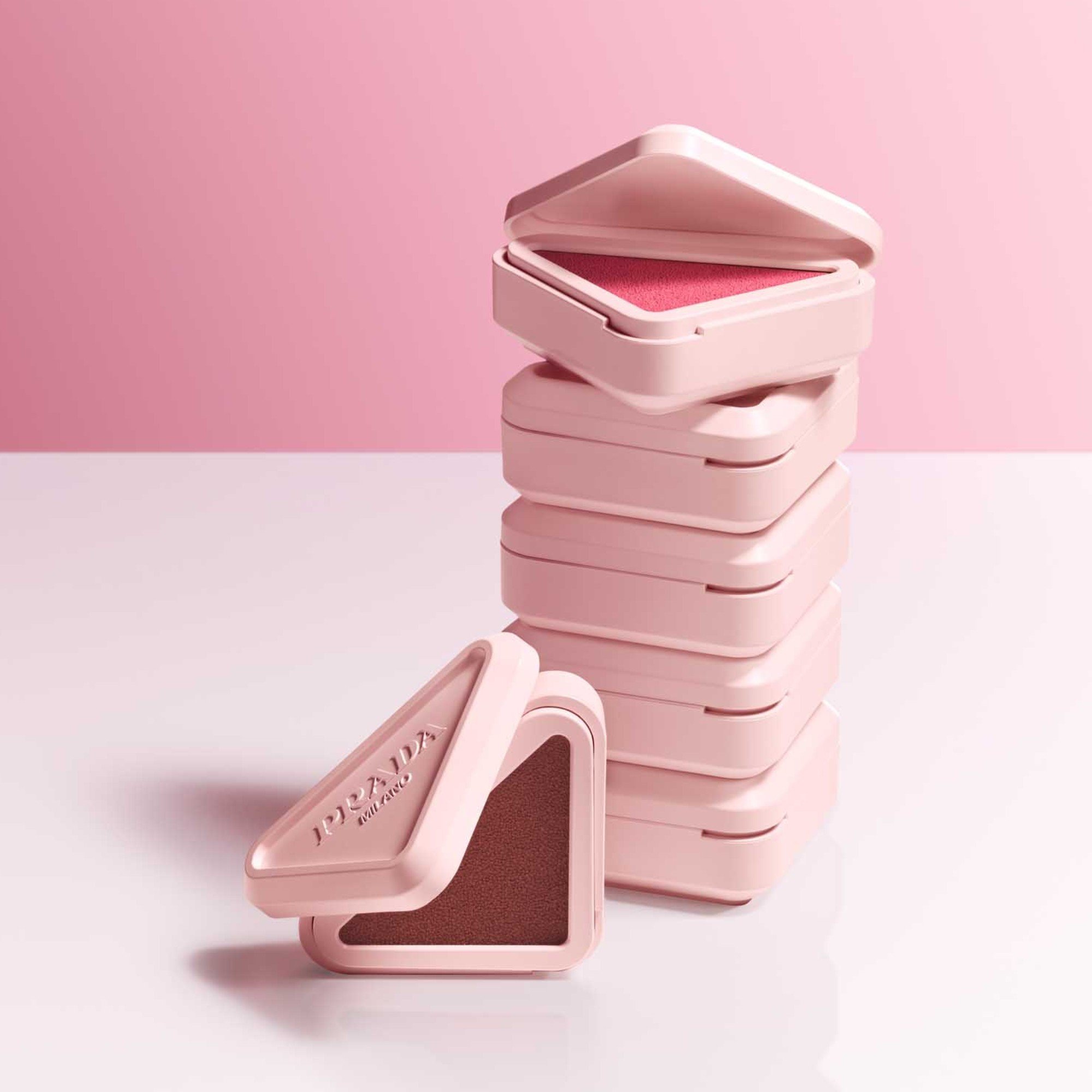 Prada Touch Cream-to-Powder Blush stacked one on top of the other.