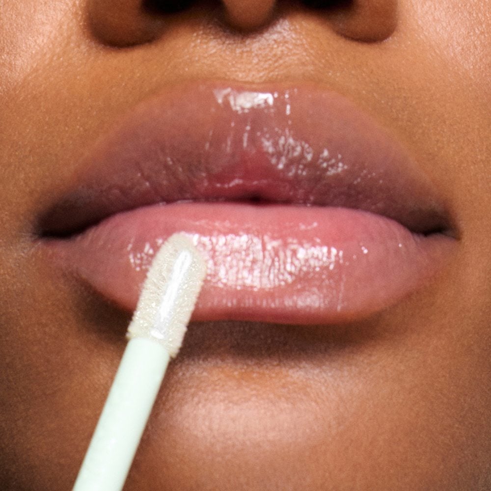 Prada Reflection Glossy Liquid Balm in shade Universal on Dark Skin Model Lips