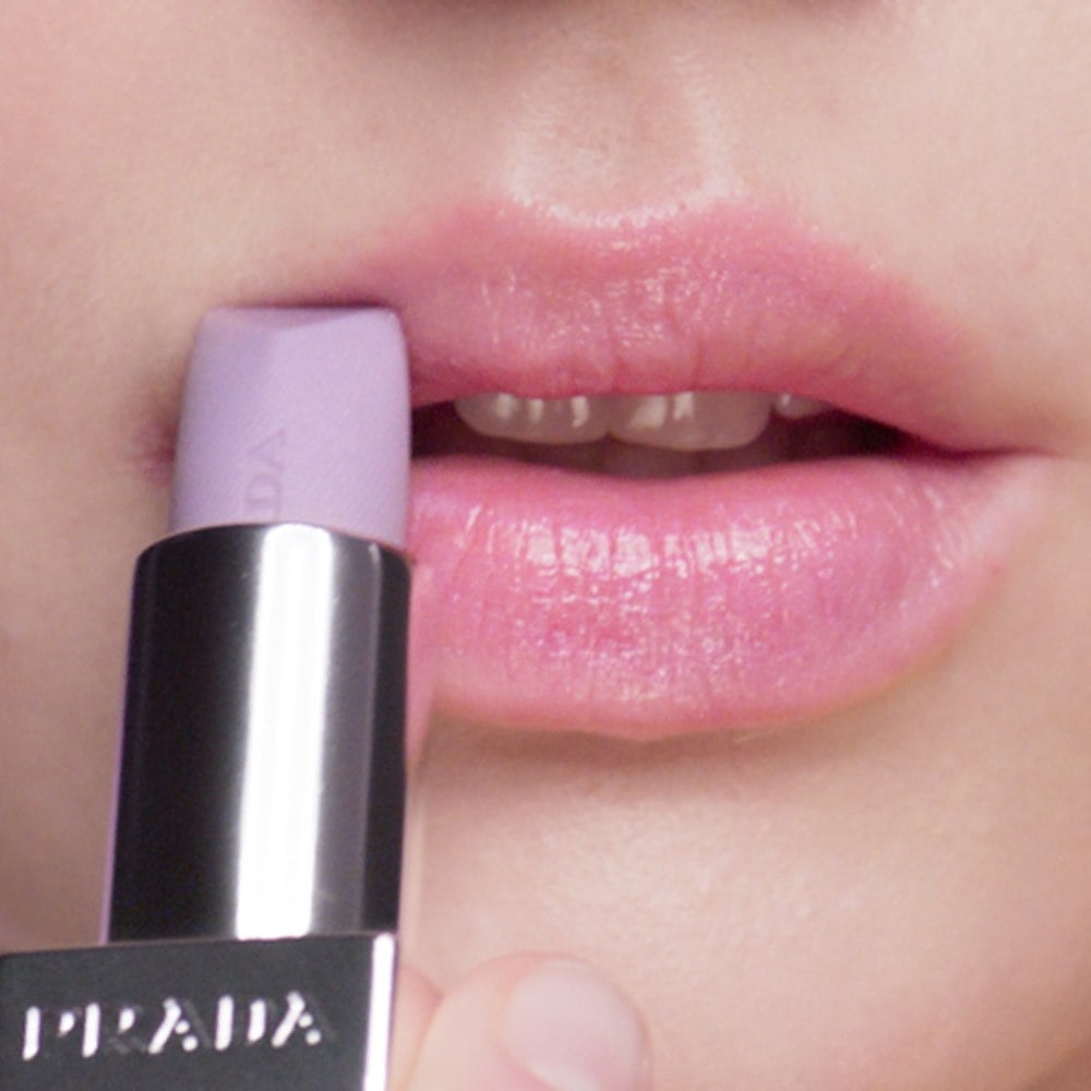 Prada Balm Lip Luminizing Care in shade Wisteria Gleams on Caucasian Model Lips